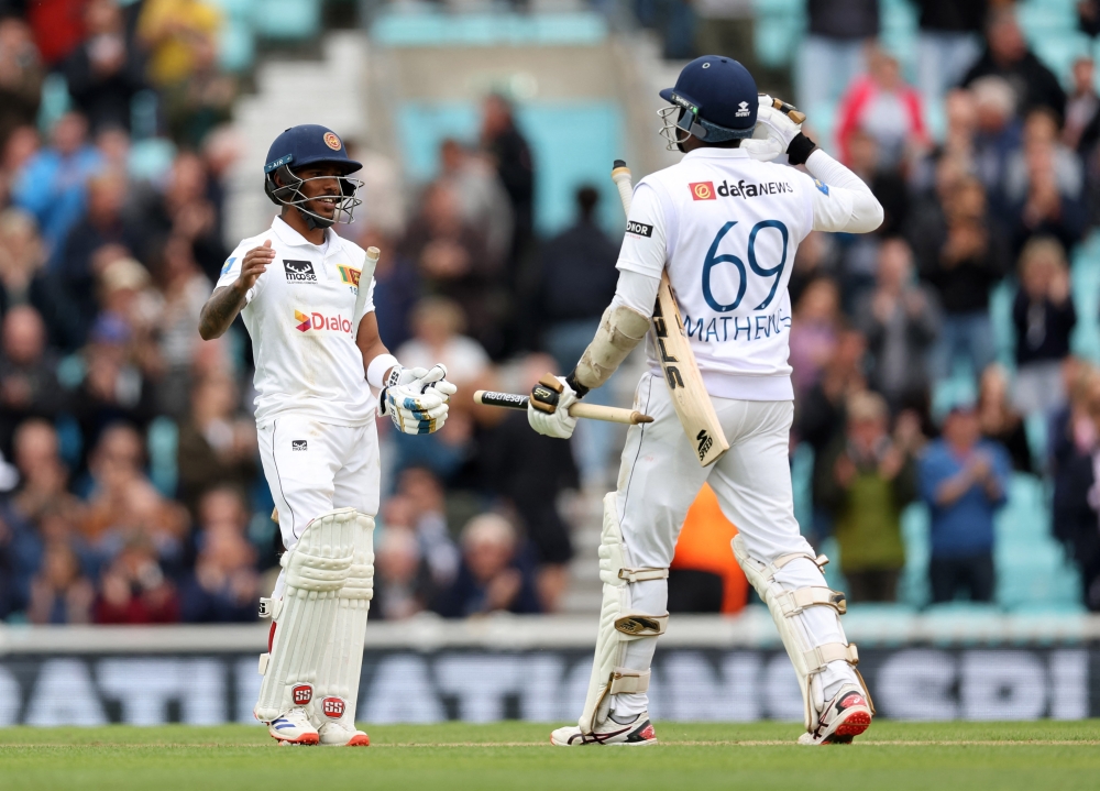 Cricket - Third Test - England v Sri Lanka - The Oval, London, Britain - September 9, 2024 Sri Lanka's Pathum Nissanka celebrates with Angelo Mathews after winning the match Action Images via Reuters/Paul Childs
