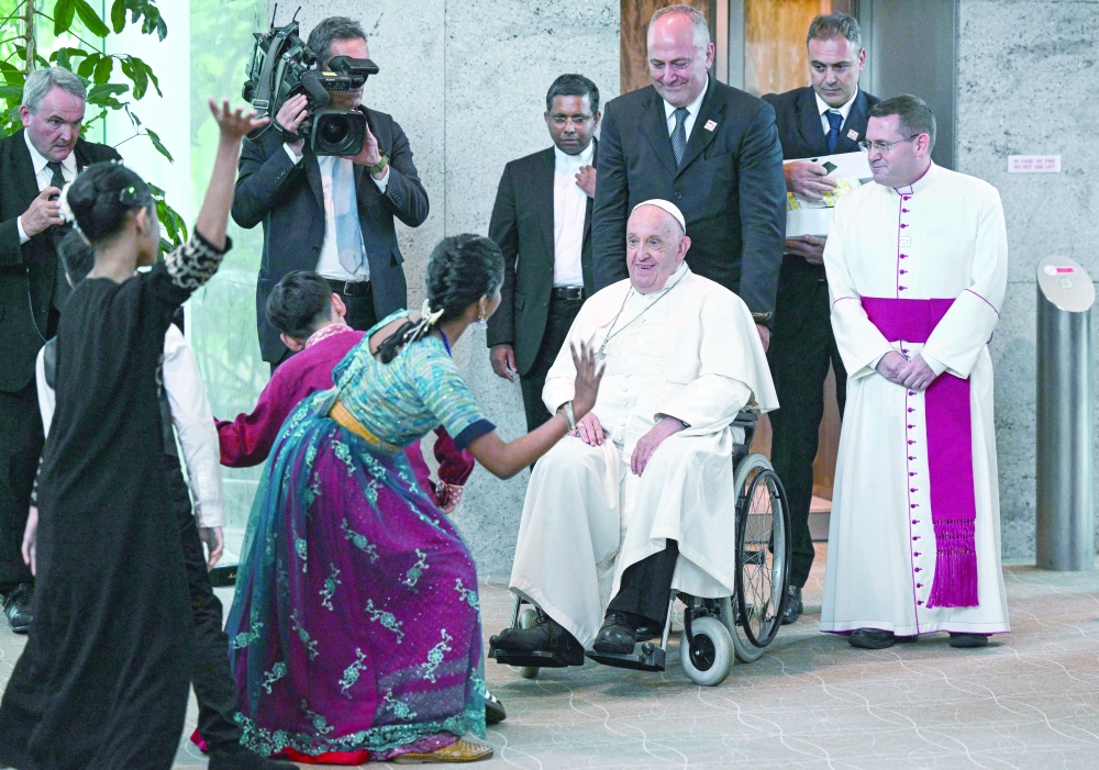 Pope Francis is welcomed upon arrival at Changi airport in Singapore. - AFP