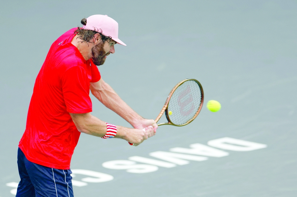 Reilly Opelka of the US in action during his match against Chile's Cristian Garin REUTERS/Tyrone Siu