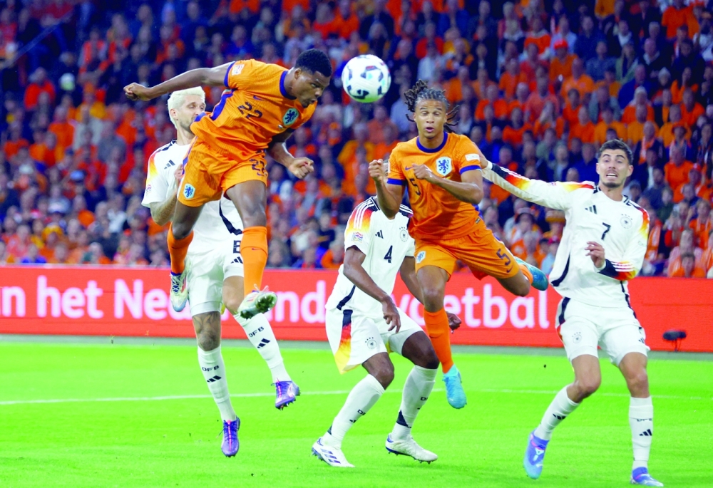 Soccer Football - Nations League - League A - Group 3 - Netherlands v Germany - Johan Cruyff Arena, Amsterdam, Netherlands - September 10, 2024 Netherlands' Denzel Dumfries heads at goal.