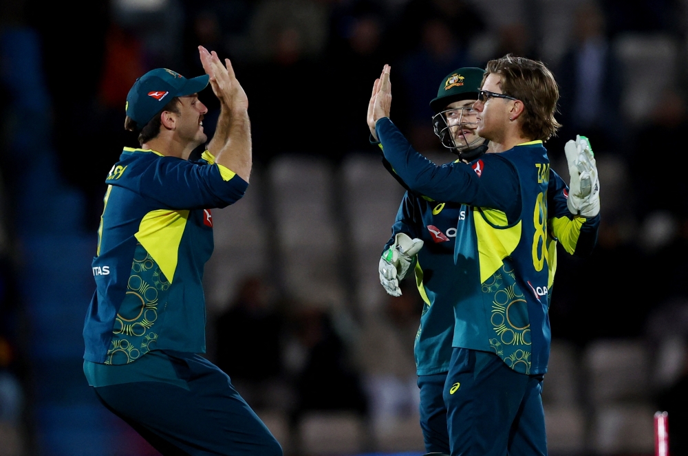 Cricket - First T20 International - England v Australia - The Ageas Bowl, Southampton, Britain - September 11, 2024 Australia's Adam Zampa celebrates with teammates after taking the wicket of England's Jaimie Overton Action Images via Reuters/Matthew Childs
