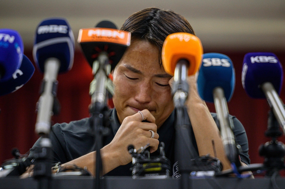 South Korean footballer Son Jun-ho reacts as he speaks during a press conference at his K League club Suwon FC in Suwon on September 11, 2024