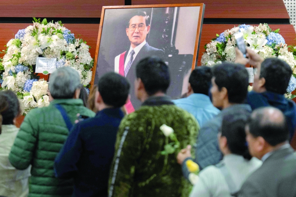 Supporters of the late former Peruvian president Alberto Fujimori