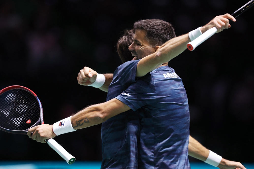 Argentina's Andres Molteni and Maximo Gonzalez celebrate after winning their doubles match against Finland's Harri Heliovaara and Patrick --REUTERS 
