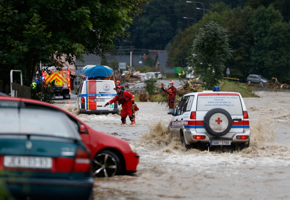 Rescuers work at a flooded area, following heavy rainfall in Jesenik, Czech Republic. — Reuters 
