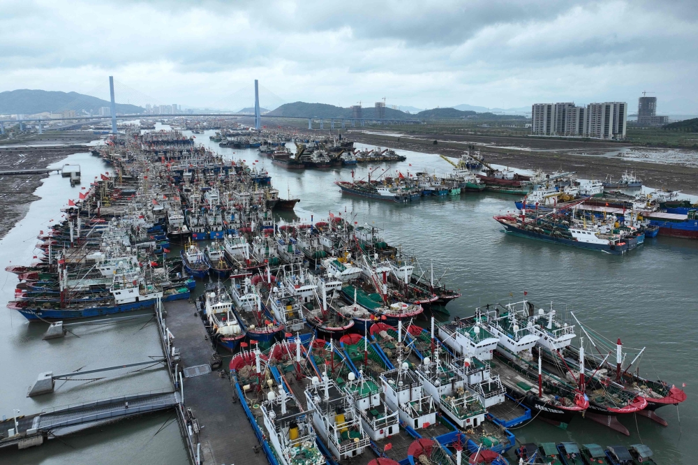 Fishing boats shelter in the port in Zhoushan, in China easter Zhejiang province ahead of the arrival of Typhoon Bebinca. — AFP 