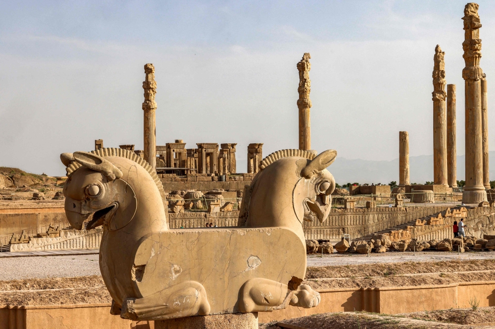 This picture taken on May 13, 2024 shows a view of a sculpture of the mythical "Huma" double griffin in the ruins of ancient Persepolis