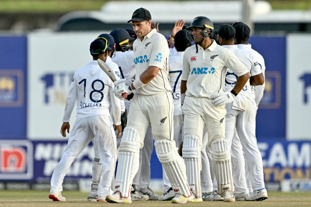 Sri Lanka's players celebrate after the dismissal of New Zealand captain. — AFP