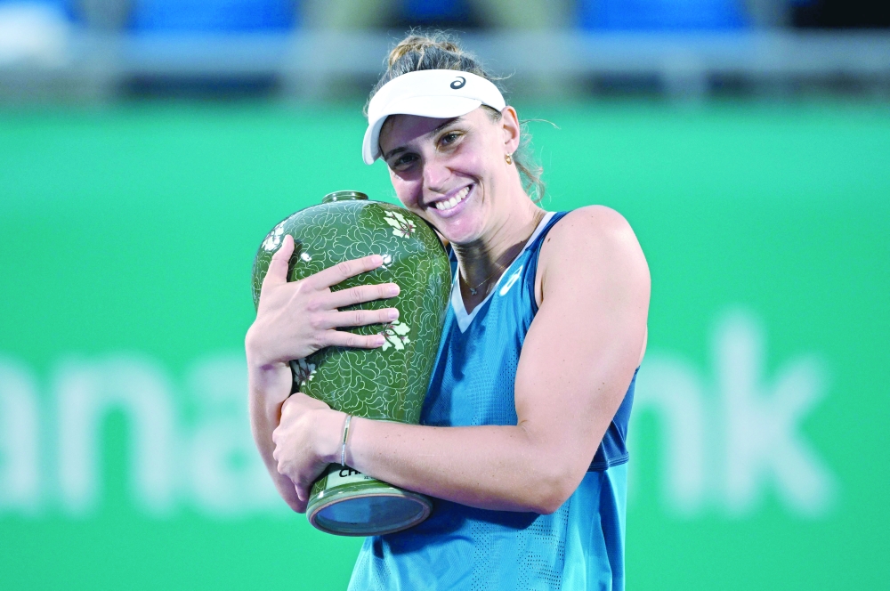 Brazil's Beatriz Haddad Maia celebrates with the trophy. — AFP