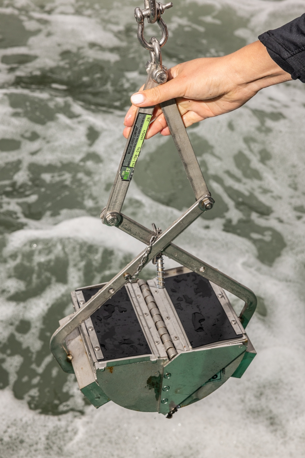 Researchers retrieve ocean floor sediment samples in Halifax Harbour, Nova Scotia, Canada, Aug. 28, 2024. (Greta Rybus/The New York Times)