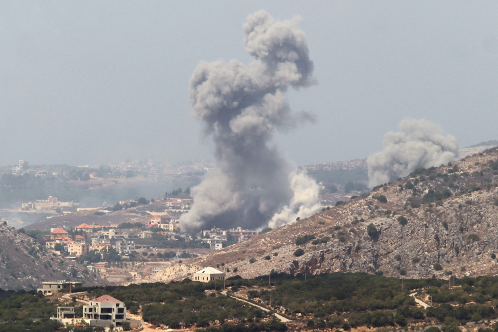 Smoke billows from a site targeted by Israeli shelling in the southern Lebanese village of Khiam in Marjeyoun  on September 23, 2024. 