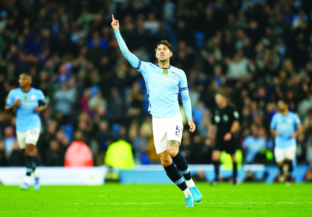 Manchester City's John Stones celebrates scoring their second goal. — Reuters