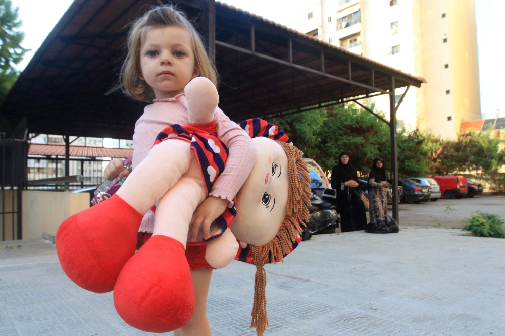 A Lebanese girl, that fled with her family from their village in southern Lebanon