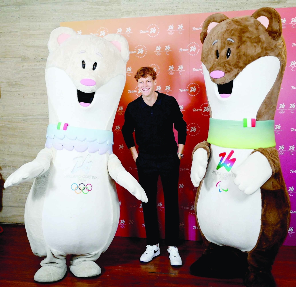 Milano Cortina 2026 - Milano Cortina 2026 Winter Olympic Games unveils official ambassador - Milan, Italy - September 19, 2024 Jannik Sinner Olympic ambassador for the Milano-Cortina 2026 Winter Olympic and Paralympic Games poses for a picture with the mascots of the Milano Cortina 2026 Winter Olympic Games.