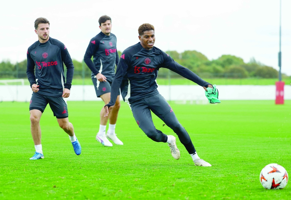Manchester United's Marcus Rashford, Harry Maguire and Mason Mount during training REUTERS/Molly Darlington