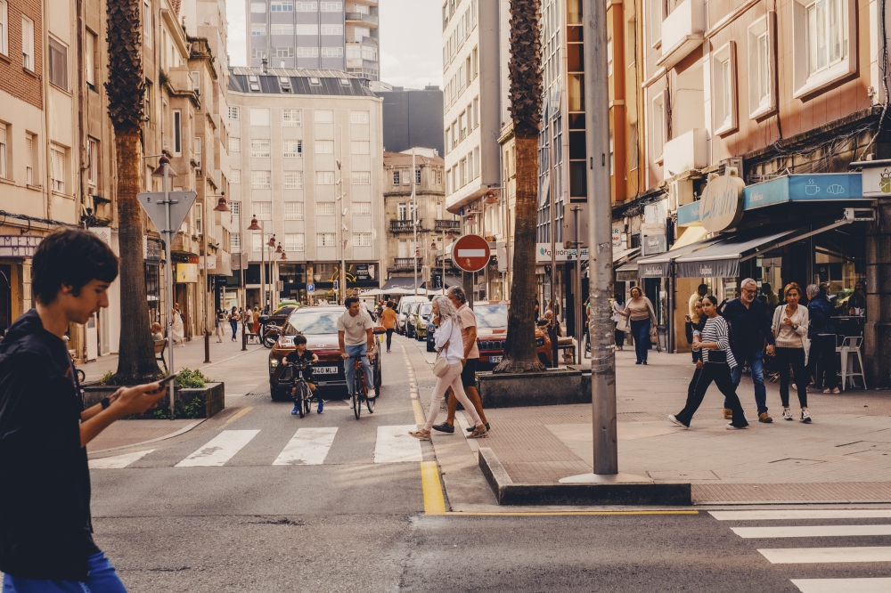 Pedestrians cross traffic in Pontevedra, a city in northwest Spain, Sept. 9, 2024.  (Matilde Viegas/The New York Times)
