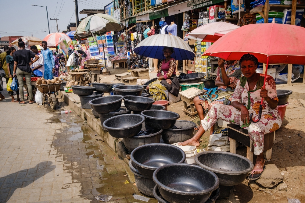 Sheltering from the heat in Bariga market in Nigerias largest city, Lagos, Feb. 13, 2023. (Taiwo Aina/The New York Times)
