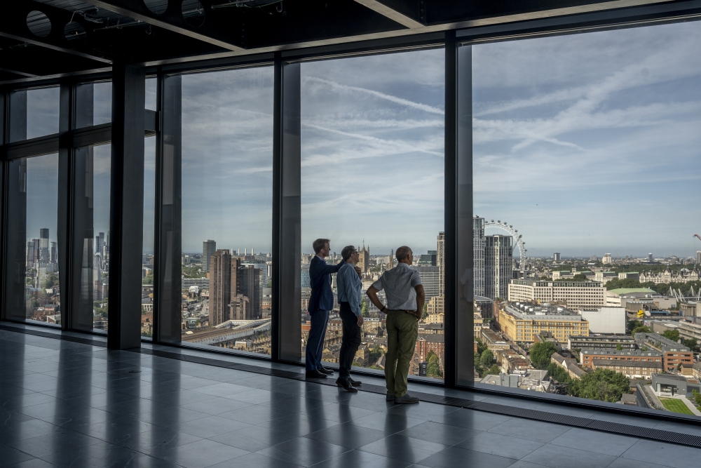 The view from the 18th floor of a Bankside Yards building with members of the project’s team: Nicholas Gray, sales and marketing; Daniel Moore, an architect and technical director; and Giovanni Festa, who oversaw the energy system design, in London, Aug.