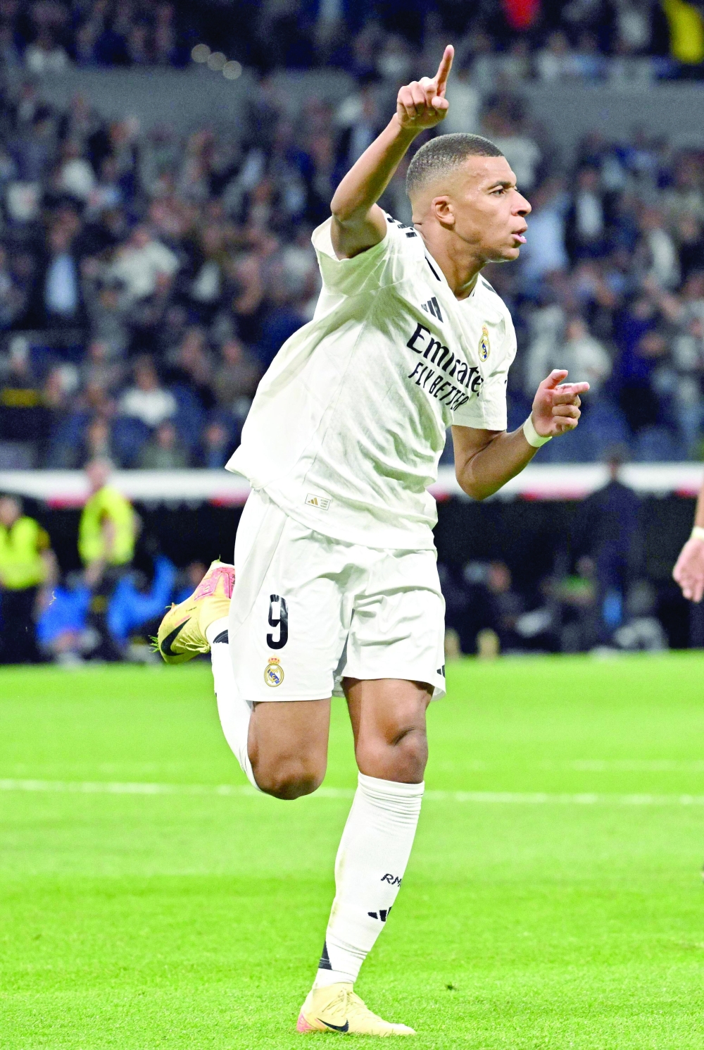 Real Madrid's French forward #09 Kylian Mbappe celebrates scoring his team's second goal during the Spanish league football match between Real Madrid CF and Deportivo Alaves at the Santiago Bernabeu stadium in Madrid on September 24, 2024