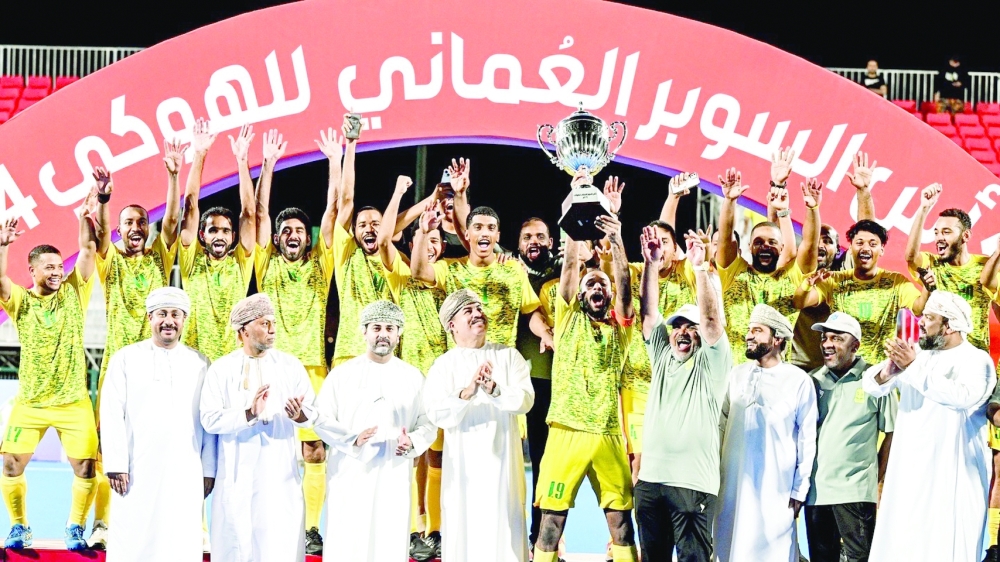 Seeb players celebrate with the Super Cup.