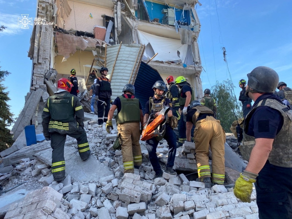 Rescuers work at the site of a Russian missile strike, in Kryvyi Rih 