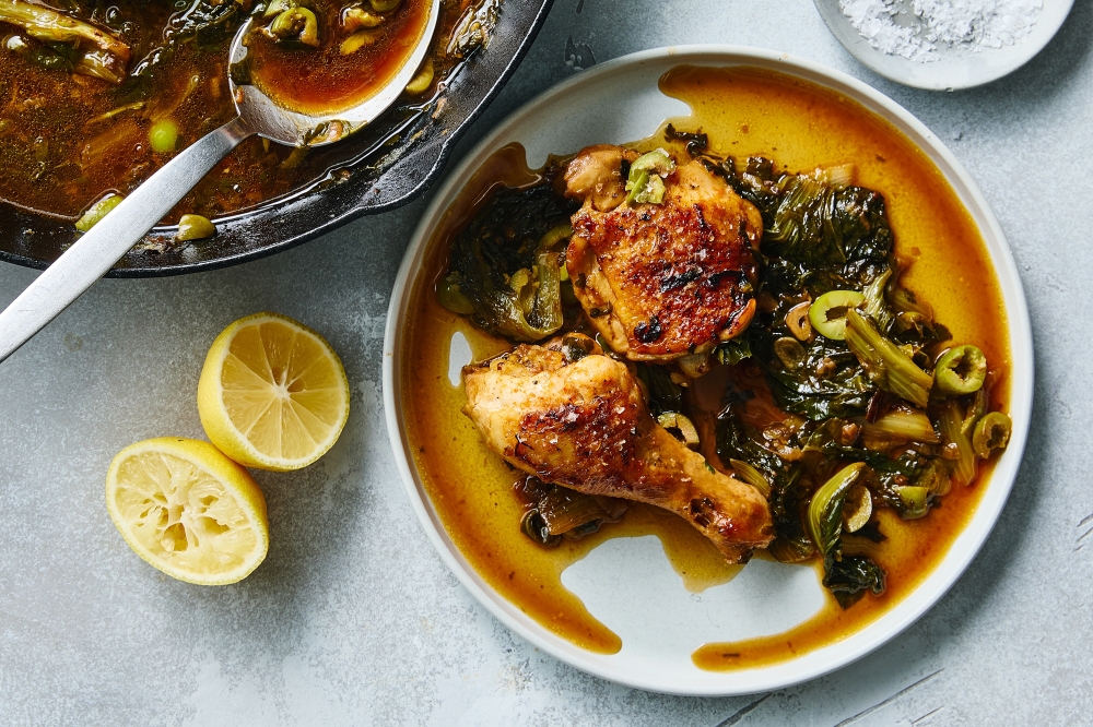 Skillet braised chicken with greens and olives. Food styled by Barrett Washburne.  