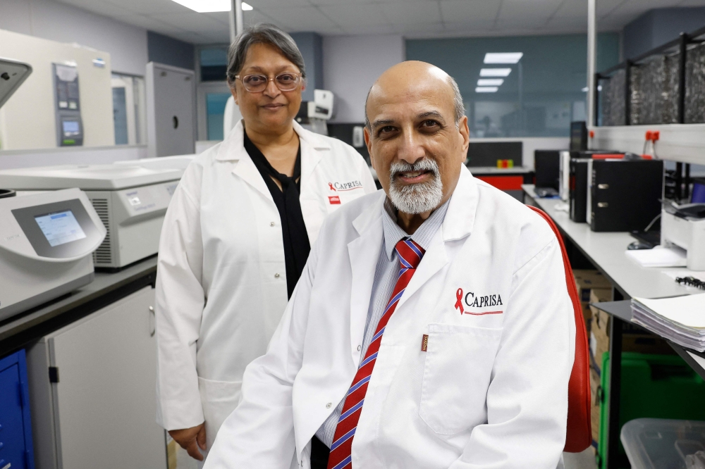 Professors Salim Abdool Karim and his wife Quarraisha Abdool Karim pose at the Centre for the Aids Programme of Research in South Africa (CAPRISA) in Durban 