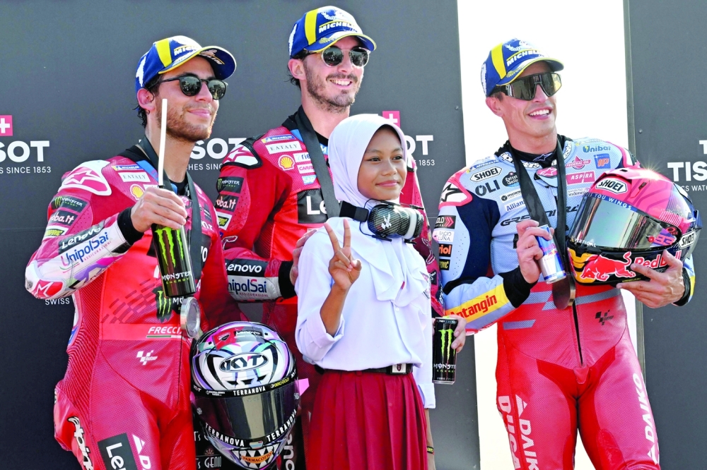 (L-R) Second-placed Enea, first-placed Francesco, third-placed Marc. — AFP