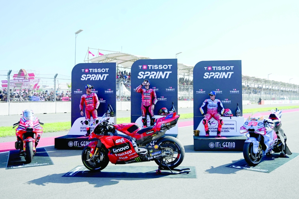 (L-R) Second-placed Enea, first-placed Francesco, third-placed Marc. — AFP
