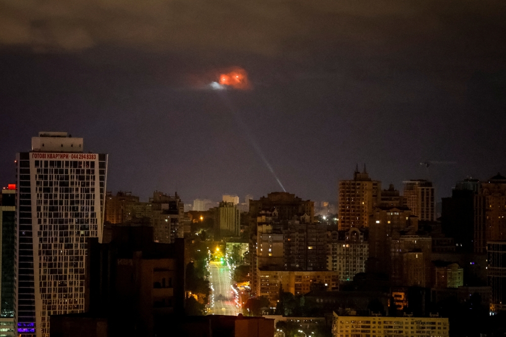 An explosion is seen in the sky over the city during a Russian drone and missile strike, in Kyiv. — Reuters 