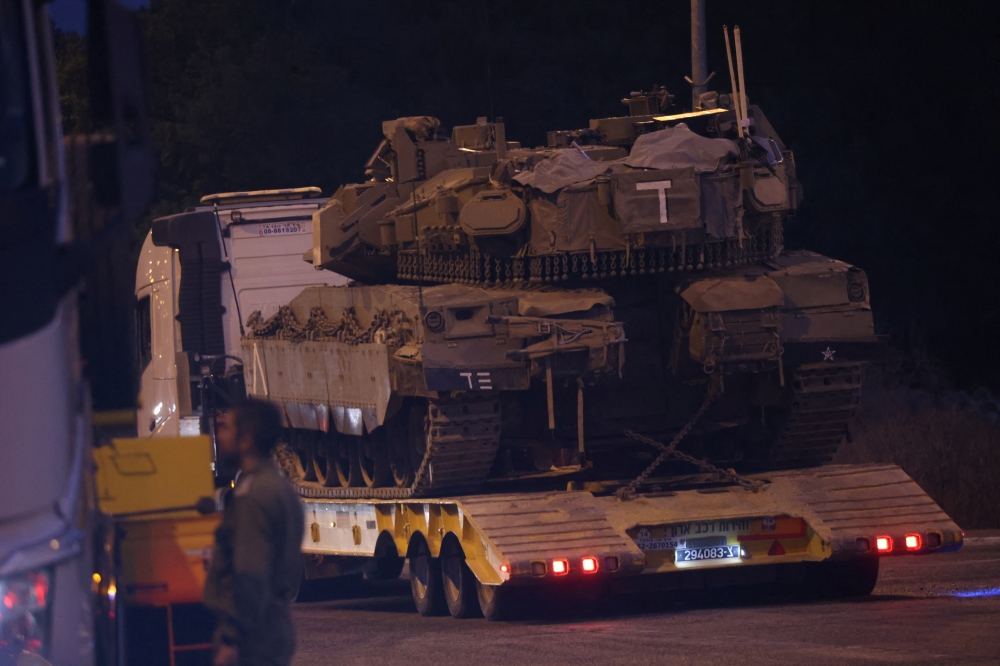 An Israeli Army tank is transported