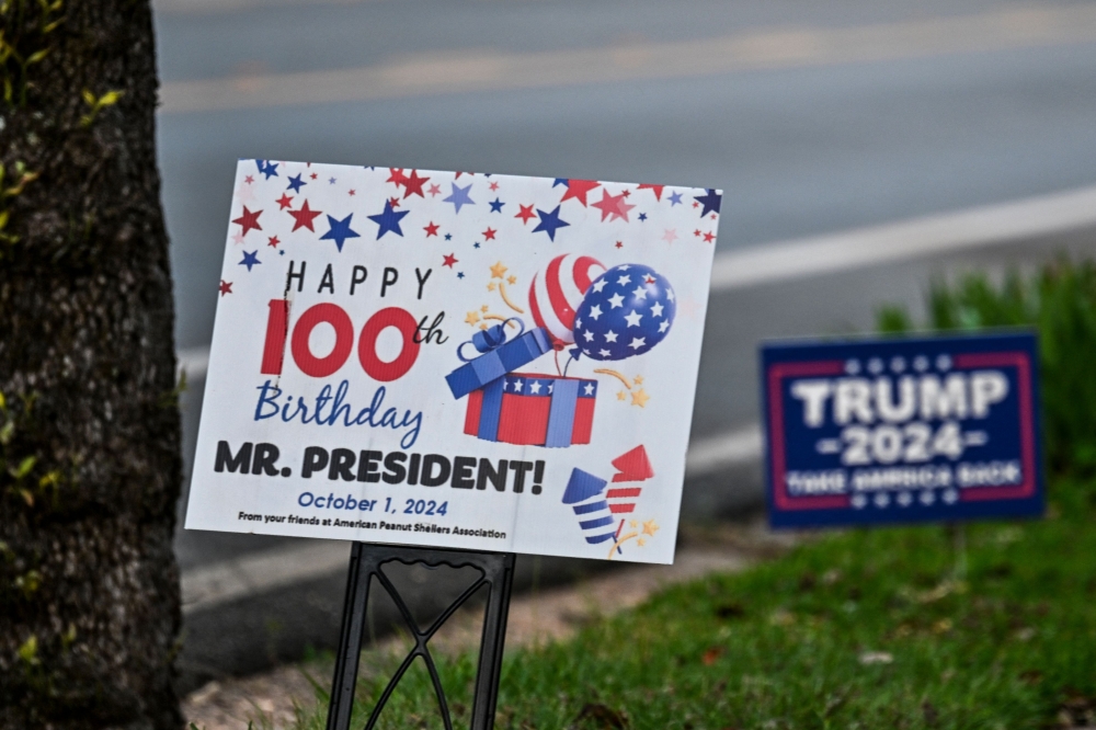 A placard celebrating former US President Jimmy Carter's 100th birthday 