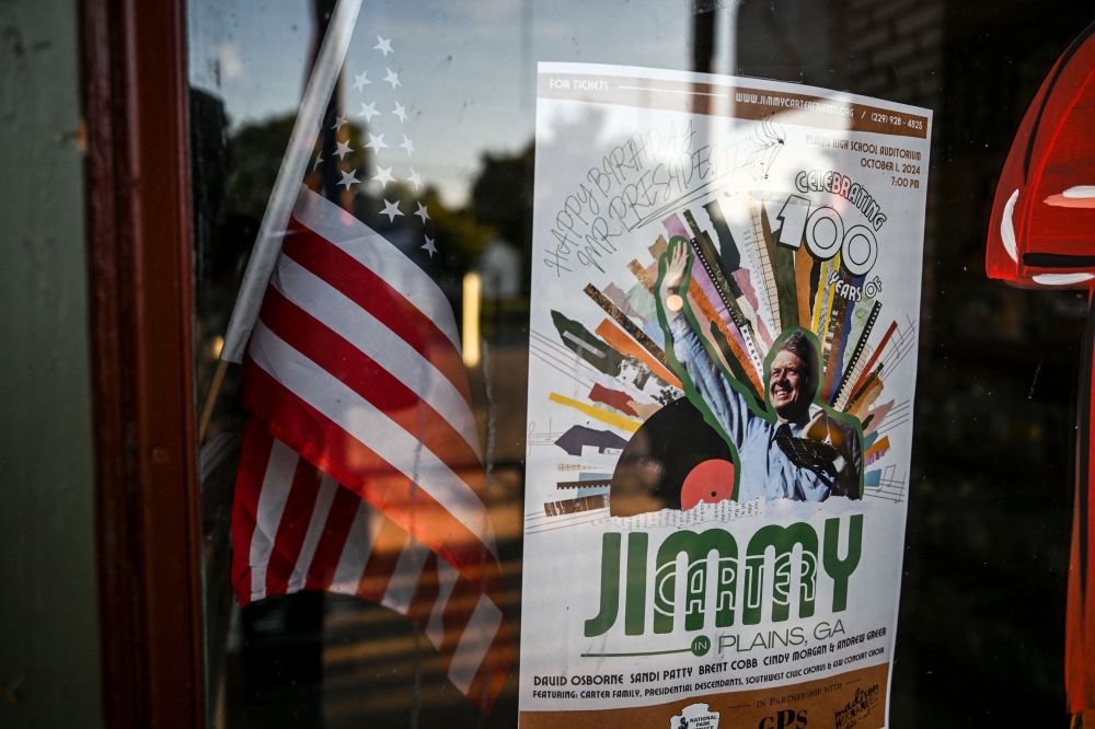 A placard celebrating former US President Jimmy Carter 100th Birthday is displayed, Georgia. — AFP 