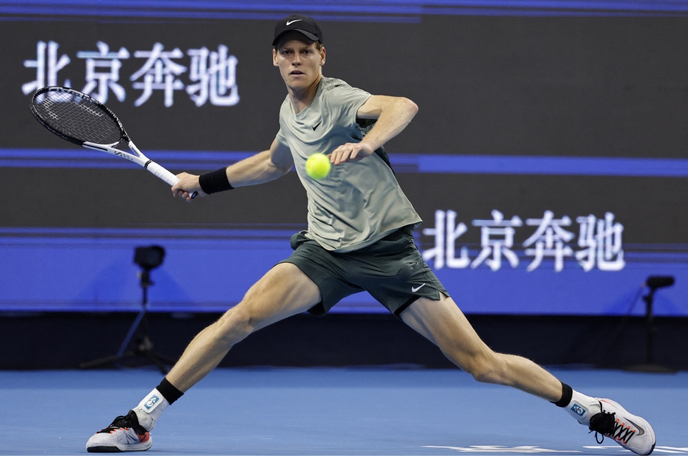 Tennis - China Open - China National Tennis Center, Beijing, China - October 1, 2024 Italy's Jannik Sinner in action during his semi final match against China's Yunchaokete Bu REUTERS/Tingshu Wang
