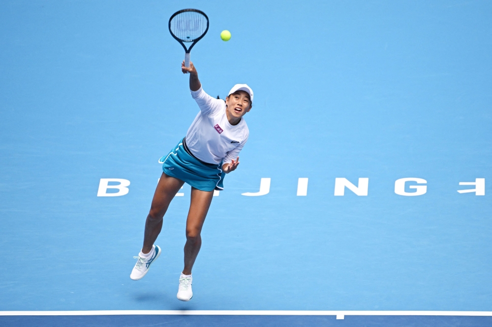 China Zhang Shuai serves to Poland痴 Magdalena Frech during their women singles match at the China Open tennis tournament in Beijing on October 1, 2024. (Photo by GREG BAKER / AFP)