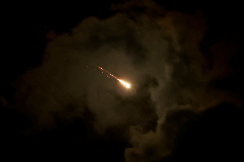 A rocket is seen, amid cross-border hostilities between Hezbollah and Israel, as seen from Tel Aviv
