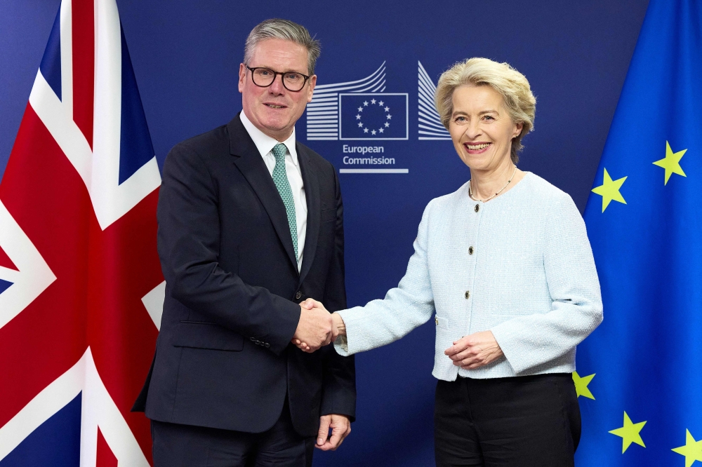 Britain's Prime Minister Keir Starmer shakes hands with European Commission president Ursula von der Leyen (R) at the European Commission headquarters in Brussels. — AFP 