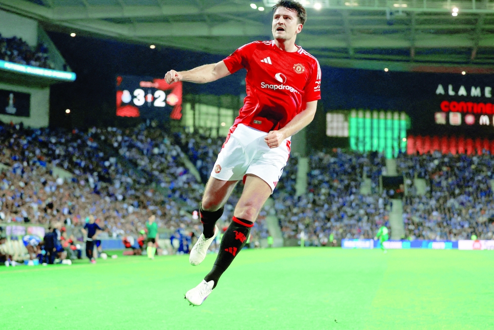 Manchester United's Harry Maguire celebrates scoring their third goal  