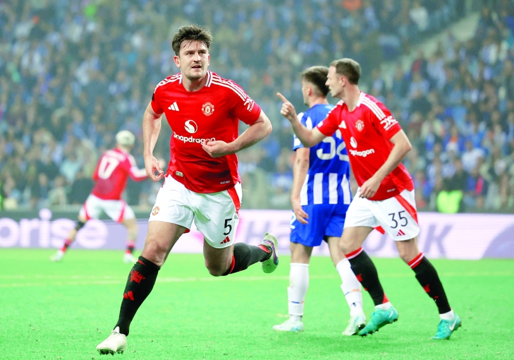 Manchester United's Harry Maguire celebrates scoring their third goal  