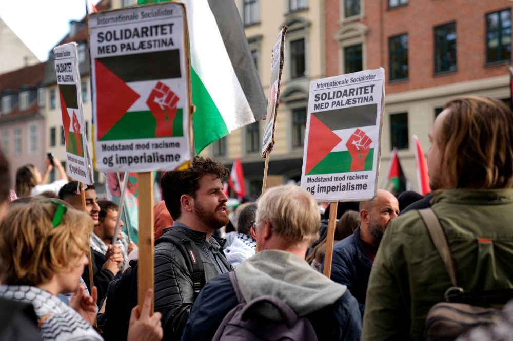 Participants march with placards during a pro-Palestinian demonstration in Copenhagen, Denmark. — AFP 
