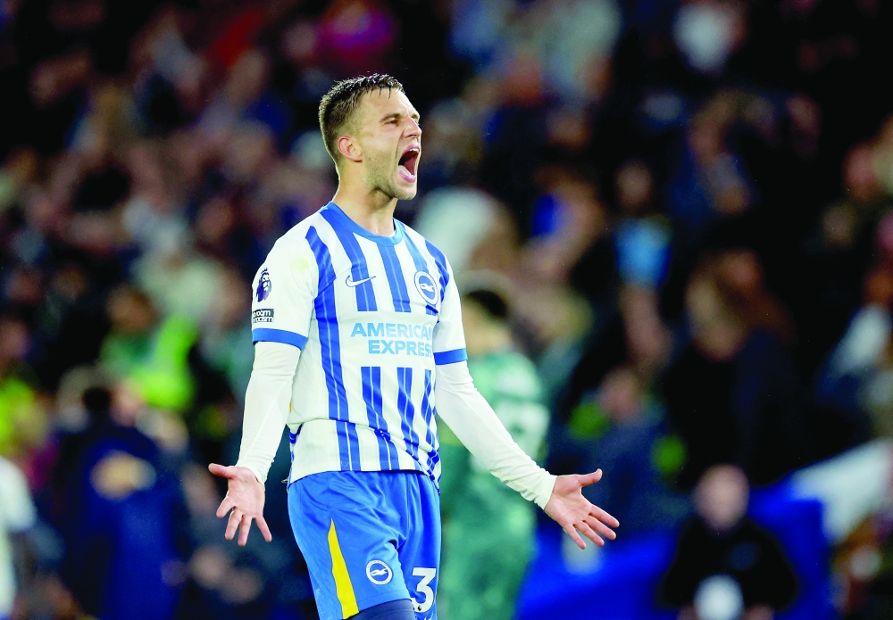 Brighton & Hove Albion's Joel Veltman celebrates after the match. — REUTERS