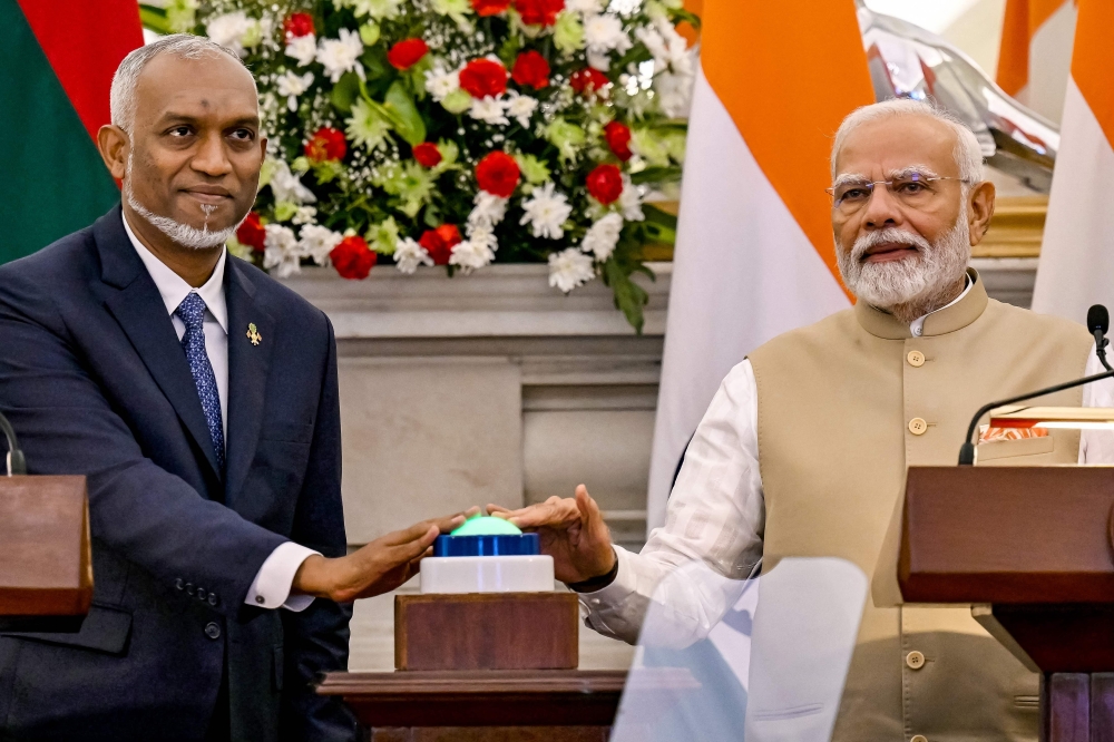 India's PM Narendra Modi (R) and Maldives President Mohamed Muizzu appear during a joint media briefing at the Hyderabad House in New Delhi. — AFP 