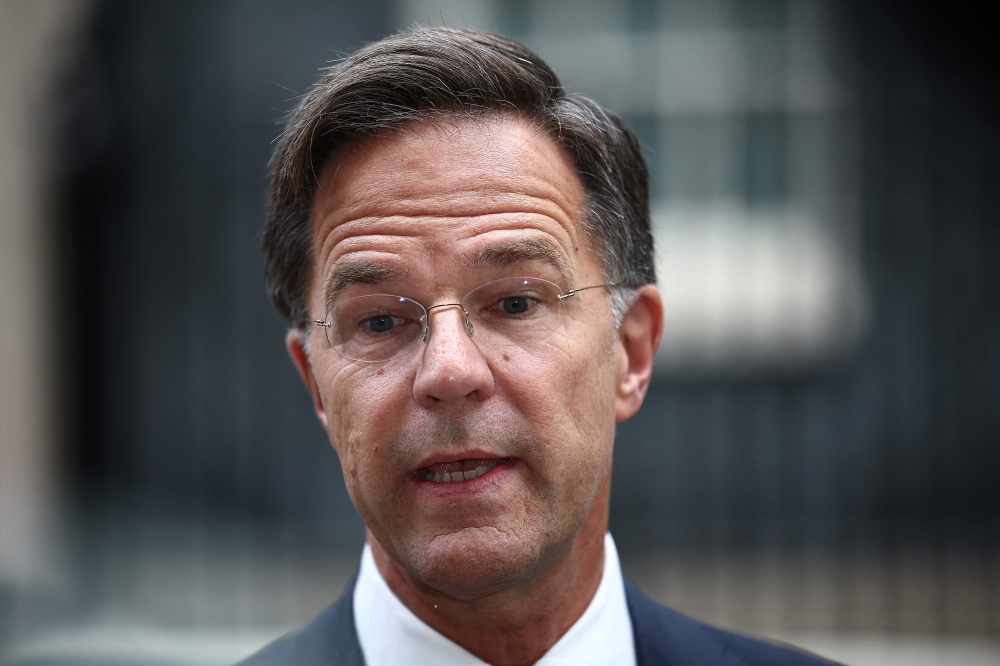 NATO Secretary General Mark Rutte speaks to members of the media as he leaves after meeting with Britain's Prime Minister at 10 Downing Street in central London on October 10, 2024. President Volodymyr Zelensky met UK premier Keir Starmer and Nato chief Mark Rutte in London Thursday, as the Ukrainian leader embarked on a whistle-stop tour of European capitals aimed at securing military aid before next month's crunch US election. (Photo by HENRY NICHOLLS / AFP)

