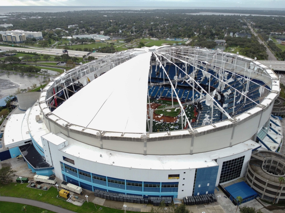 A drone image shows the dome of Tropicana Field which has been torn open due to Hurricane Milton in St Petersburg, Florida. - AFP