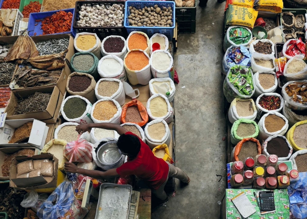A vendor prepares a bag for a customer at a wholesale market, amid the country's economic crisis in Colombo, Sri Lanka. — Reuters