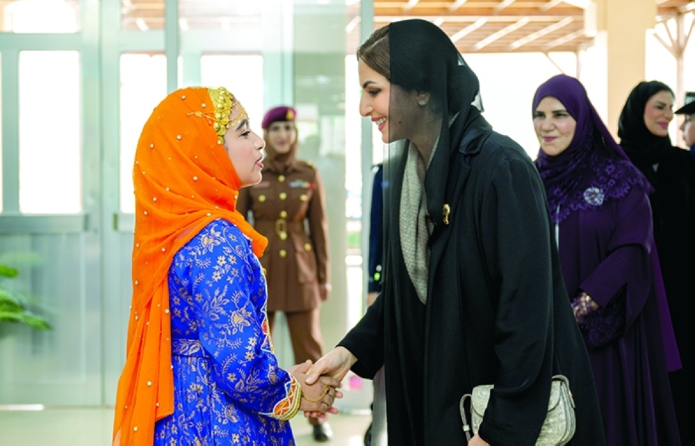 
HH The Hounourable Lady Assayida Ahd Abdullah Hamed al Busaidi welcomed by a student of Jawharat Muscat School in A’Seeb on Thursday

