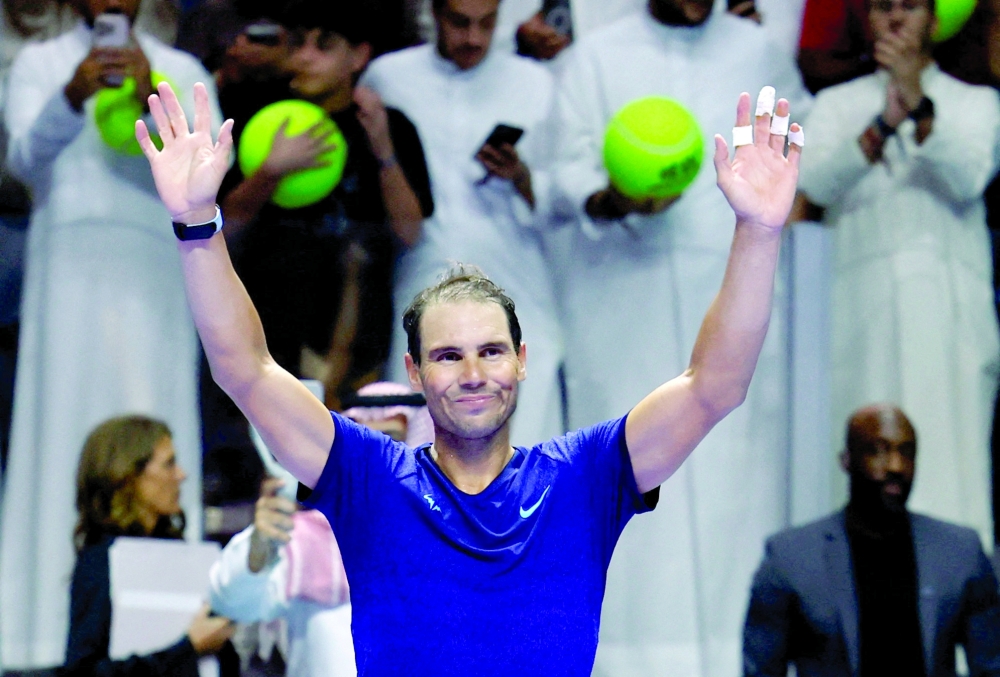 Spain's Rafael Nadal waves at fans after losing his semifinal match against Spain's Carlos Alcaraz 