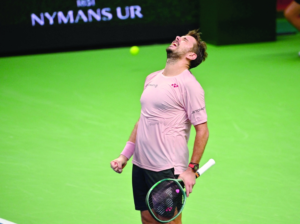 Switzerland's Stan Wawrinka celebrates after winning. — AFP