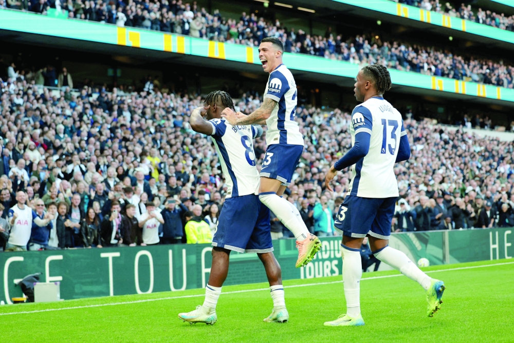 Bissouma celebrating with Pedro and Destiny. — Reuters