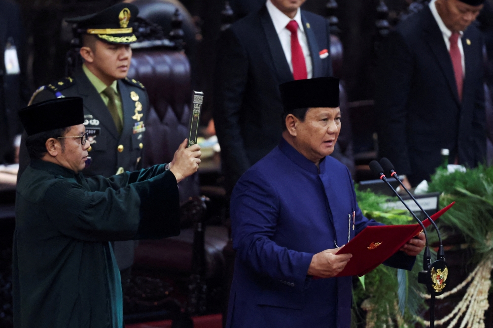 Indonesia's new President Prabowo Subianto is sworn in during his presidential inauguration at the House of Representative building in Jakarta. — Reuters